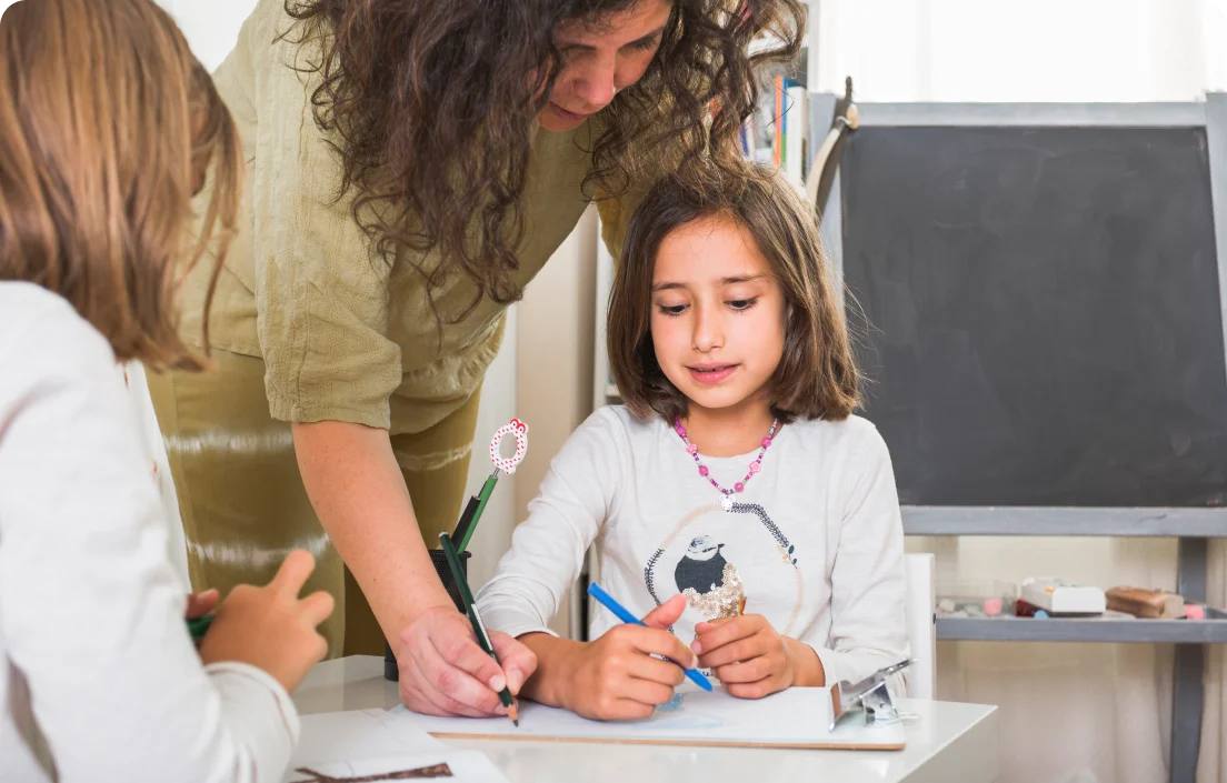 Teacher working with a student, highlighting signs for IEP support services